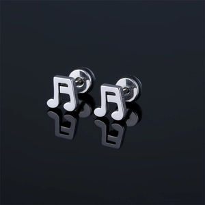 Macro detail of silver stainless steel musical note stud earrings with reflection