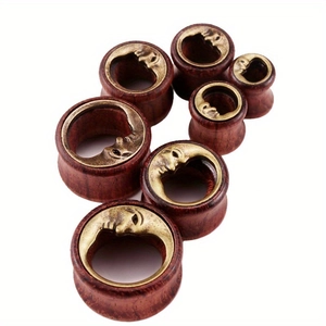 Set of moon face wood ear gauges in seven sizes for stretched earlobe piercings