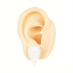 Translucent white opal resin ear gauges showing on a silicone human ear model