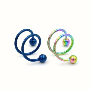 Détail de bijoux de corps spirale en acier inoxydable avec finis bleu et arc-en-ciel