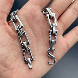 Silver stainless steel chain bracelet with textured rectangular links and lobster clasp