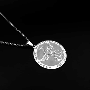 Close-up of Saint Michael medal necklace in stainless steel with detailed relief