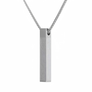 Detailed macro view of the silver rectangular pendant with a durable box chain necklace