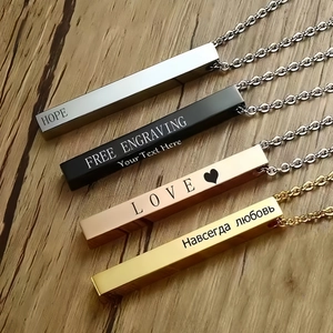 Detailed view of rectangular stainless steel pendant necklaces with custom laser engraving