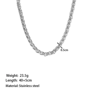 Macro shot of 0.5cm wide stainless steel wheat chain necklace with woven texture
