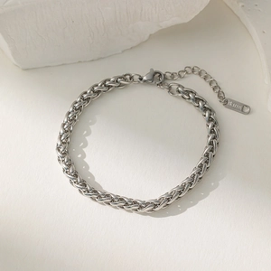 Close-up of stainless steel spiga chain with lobster clasp and S. STEEL tag