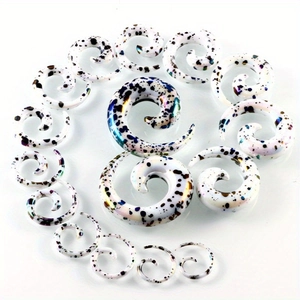 Spiral acrylic ear gauges with colorful ink splatter patterns in various sizes