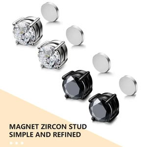 Détail macro de boucles d'oreilles magnétiques en zircon et acier inoxydable noir