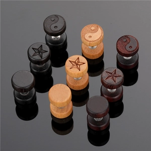 Set of wooden barbell stud earrings in black and brown with star and tai chi patterns