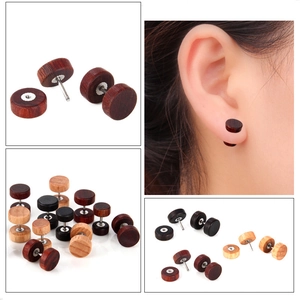 Detail showing natural wood stud earrings with various wood grains and metal screw posts