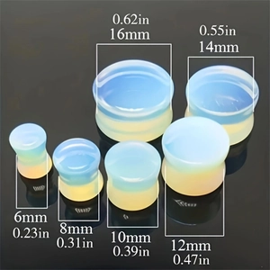 Translucent opal glass ear gauges in six sizes with a smooth polished finish