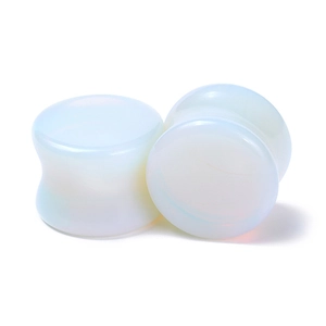 Pair of polished translucent opalite glass double flare ear plugs for stretching