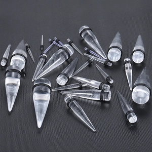 Dehnstab-Set aus klarem Acryl mit schwarzen O-Ringen auf strukturiertem Grund