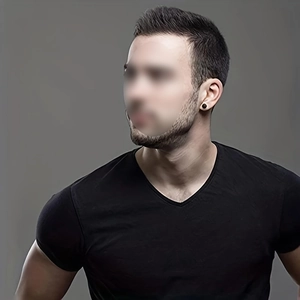 Close-up of a man wearing a black round stainless steel stud earring with matte finish