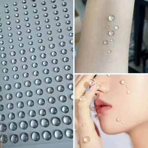 Macro detail of various sizes of 3D crystal clear teardrop face and body gems