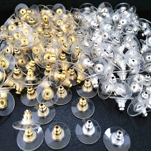Bulk gold and silver stainless steel earring backs with circular plastic comfort pads