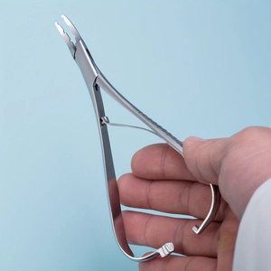 Detailed macro view of professional stainless steel piercing pliers with non-slip handles