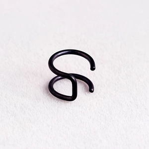 Matte black stainless steel double layer ear cuff for non-pierced ears on white fabric