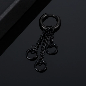 Detail of black punk hoop earring with multiple hanging chains and ring pendants