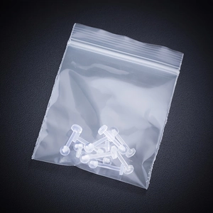 Detailed view of clear acrylic lip rings set in transparent PE zip-lock packaging