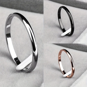 Minimalist 2mm stainless steel rings in silver, black, and rose gold polished finishes