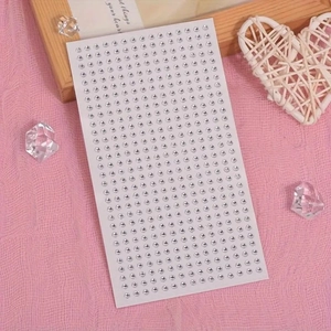 DIY self-adhesive silver rhinestone stickers on a decorative pink background