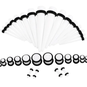 Detailed set of white acrylic ear tapers and plugs with black O-rings in varied sizes