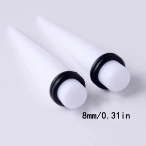 Detail view of 8mm white acrylic ear tapers with black rubber O-rings and 0.31 inch size