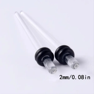 Detailed macro view of 2mm transparent acrylic ear taper with black rubber O-rings