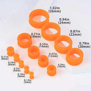 Set aus hellorangen Silikon-Ohr-Tunnels in Größen von 3mm bis 26mm zur Ohrendehnung
