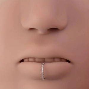Detailed macro view of 316L stainless steel nose ring with pavé-set sparkling zircons