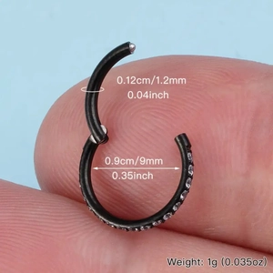 Detail of 316L black steel nose ring with sparkling CZ inlay and clicker design