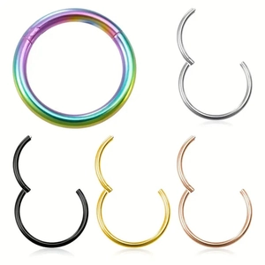 Detail of 316L stainless steel nose rings with crystal accents in five various colors