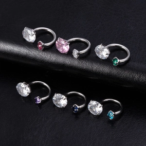 Detail of horseshoe piercings with AAA zircon in six vibrant colors on black leather