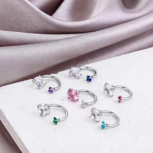 Detail view of 6-piece titanium steel horseshoe rings with multi-color AAA cubic zirconia