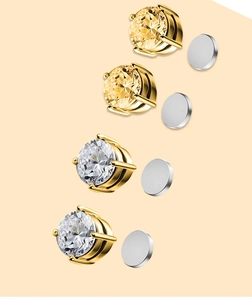 Detail of magnetic zircon studs showing gold 4-claw settings and magnetic bases