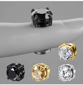 Detail view of non-pierced magnetic zircon stud earrings in various metallic finishes