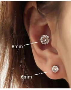 Detailed comparison of 8mm and 6mm magnetic zircon stud earrings worn on model ear