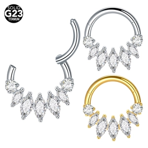 Detailed macro view of G23 titanium septum clicker with marquise cubic zirconia stones