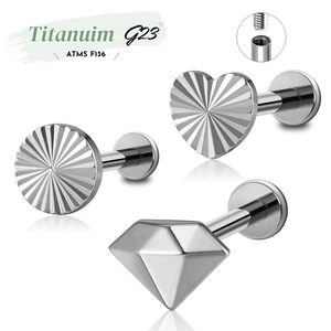 Detail of ASTM F136 titanium piercing studs with heart, star and round crystal tops