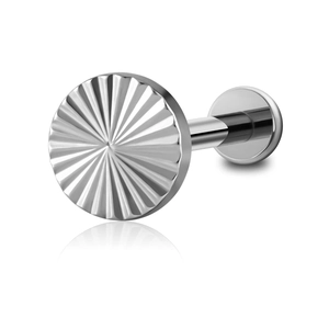 Macro shot of silver titanium labret stud with sunburst texture on a white background