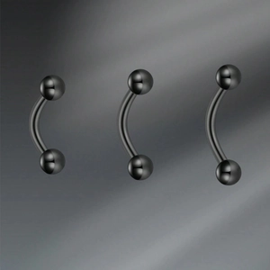 Three black stainless steel 16G eyebrow rings with polished finish on dark background
