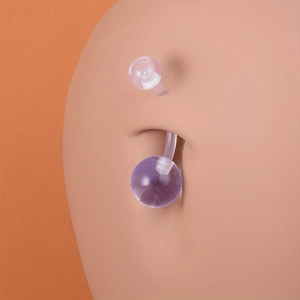 Transparent purple acrylic belly button ring with double bioflex balls on skin model