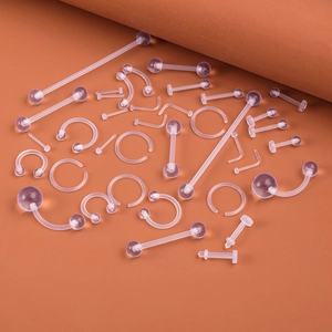 Detailed view of 37pcs clear acrylic piercing set including barbells and nose rings
