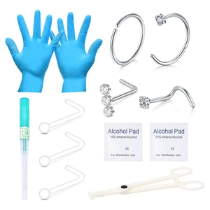 Gedetailleerde 18G piercingset met stalen sieraden, handschoenen en toebehoren