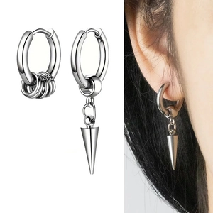 Detail of silver asymmetric stainless steel earrings with hoop and spike cone charms