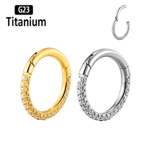 Close-up of G23 titanium clicker rings with double row of pavé set clear CZ crystals