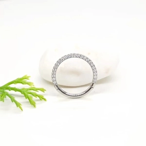 Polished ASTM F136 titanium hinged ring with double row of clear CZ crystals