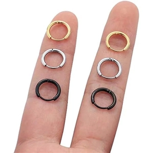 Classic 316L stainless steel hoop earrings in gold silver and black set on finger
