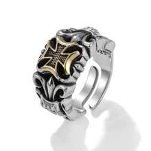 Close-up of S925 sterling silver stamp on vintage iron cross and floral relief ring
